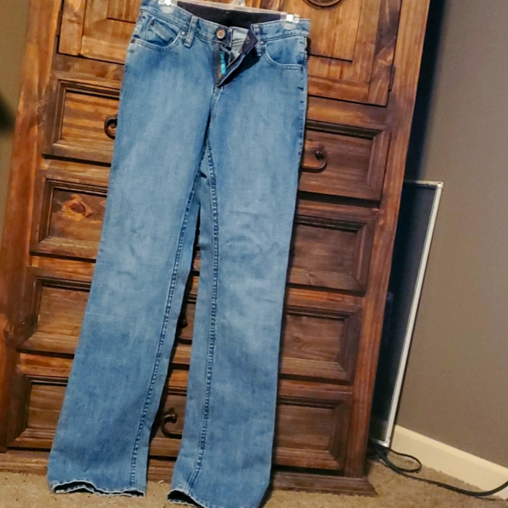 NEW. Cash Wranglers.